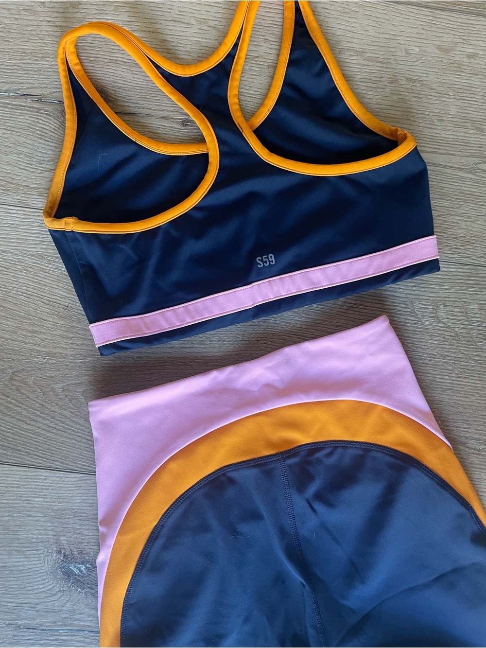 Splits59 Navy Bike Shorts & Sports Bra with Pink and Orange Trim - Picture 6 of 6
